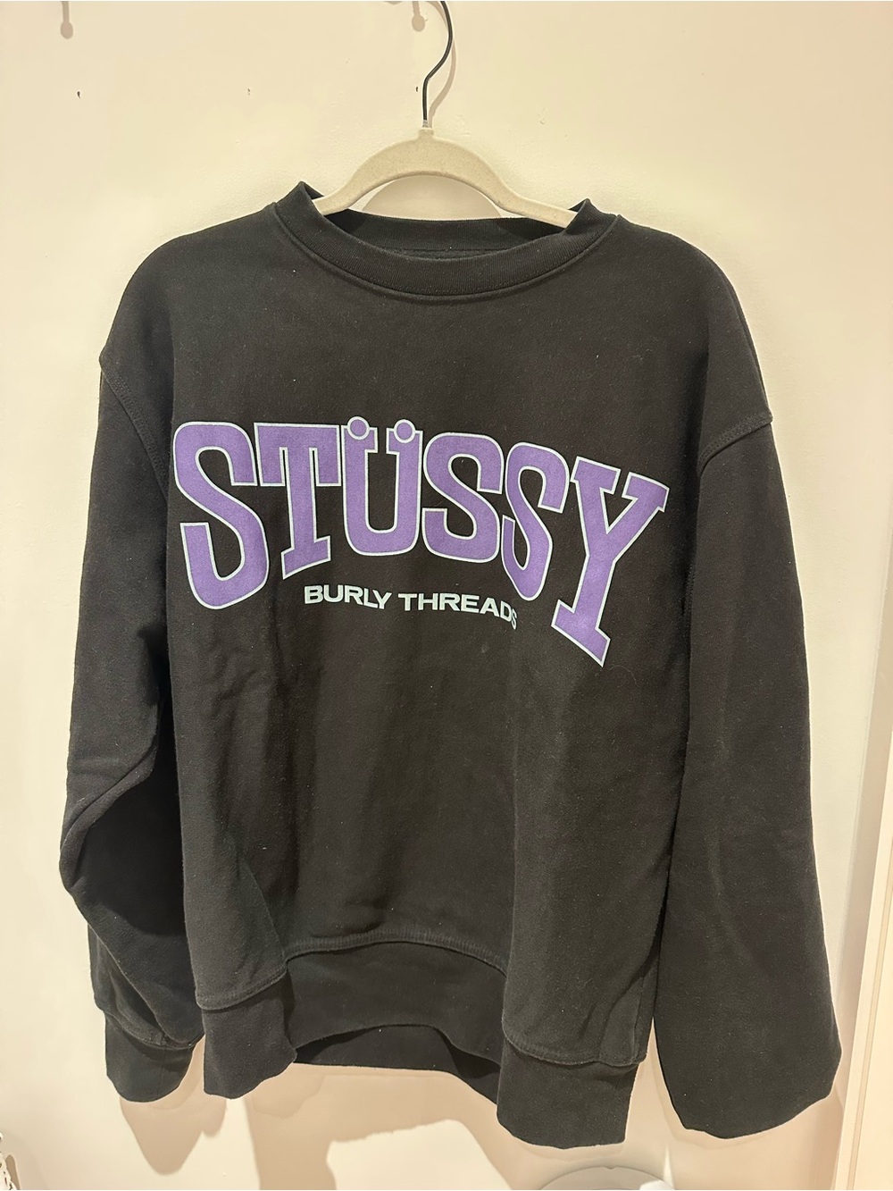 Stüssy Black Crewneck Sweatshirt with Purple Logo
